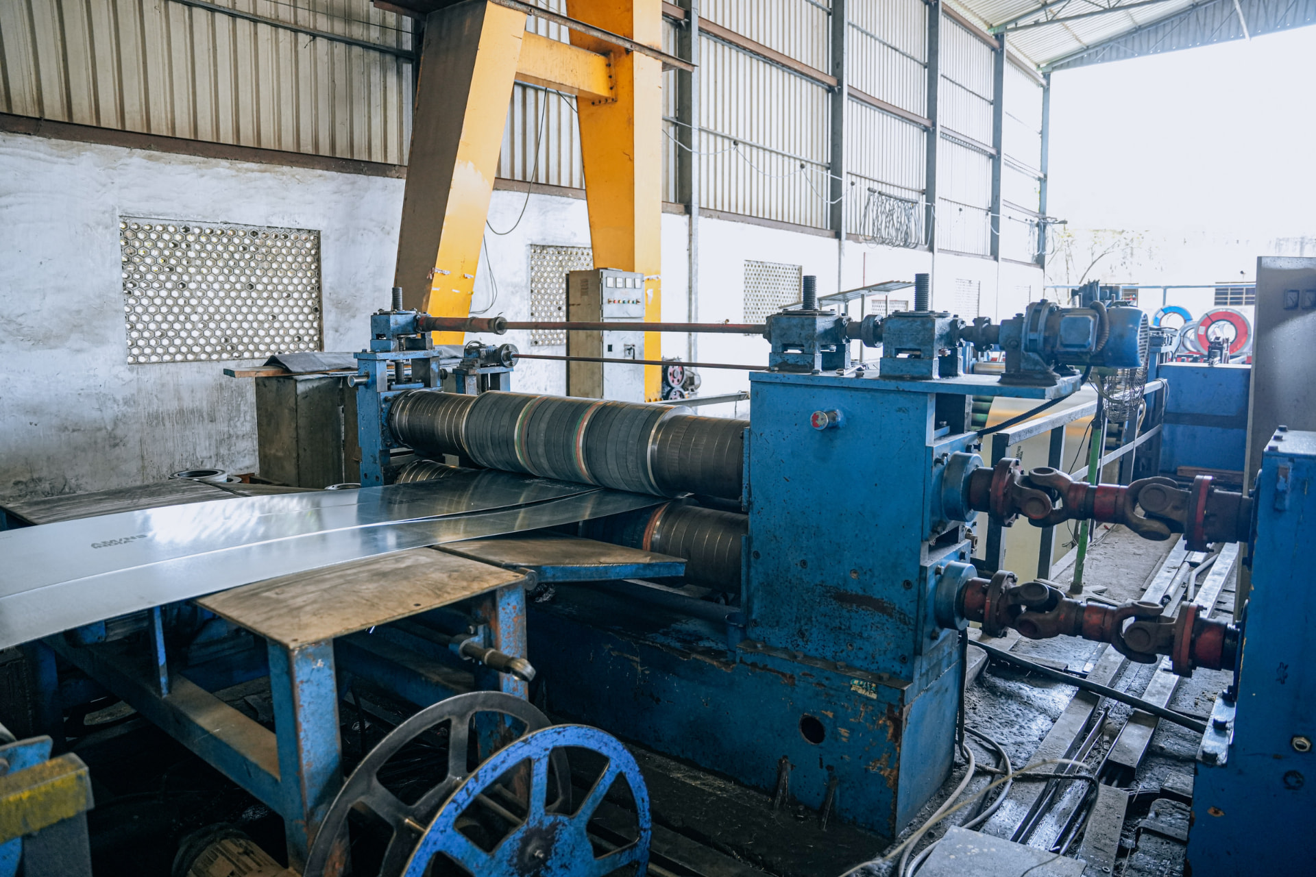Stack of cut-to-length galvanized plain (GP) steel sheets at HST Steels