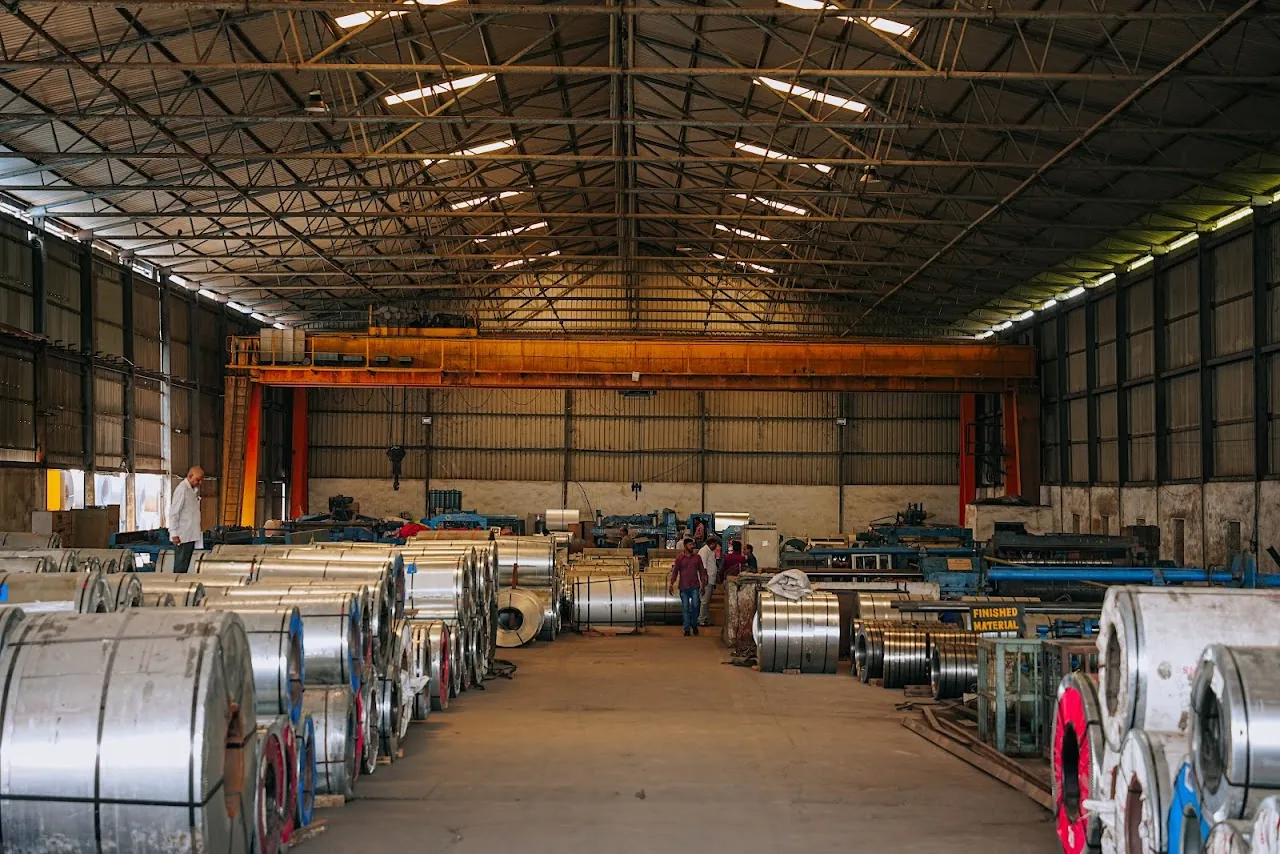 HST Steels steel processing warehouse with gantry crane and coil inventory in Jeedimetla, Hyderabad